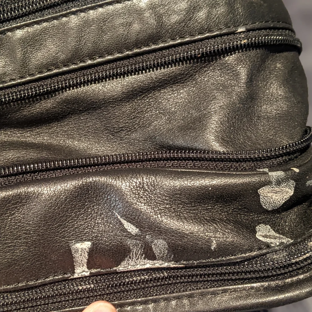 Black Tumi expandable briefcase. Fits 15